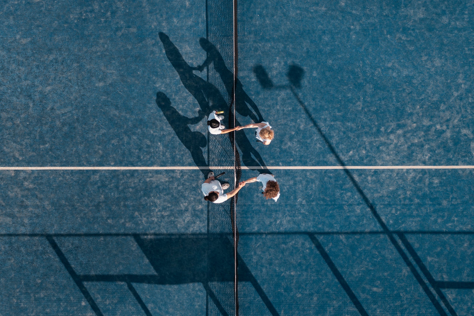 flat-lay-people-playing-paddle-tennis.jpg__PID:677ca06a-0e8e-487a-bcc4-27cf7b89305a